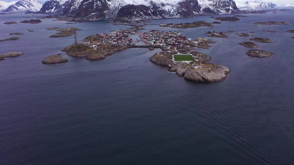 Henningsvaer Village and Mountains in Winter. Lofoten, Norway. Aerial View