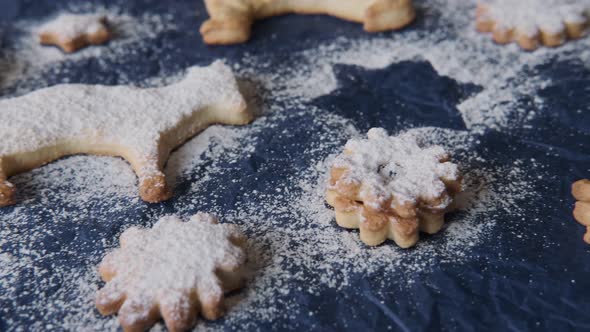 A Selection of Home Baked Cookies in Various Animal Shapes Dusted over with Confectioners' Sugar