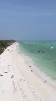 Vertical Video Kitesurfing Near the Shore of Zanzibar Tanzania