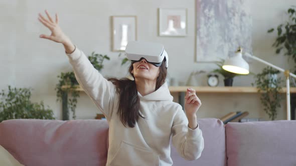 Excited Woman Experiencing Augmented Reality with VR Headset