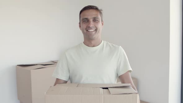 Happy Young Man Posing in His New Apartment