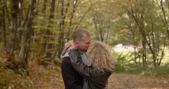 Happy Couple on a Date in the Autumn Forest