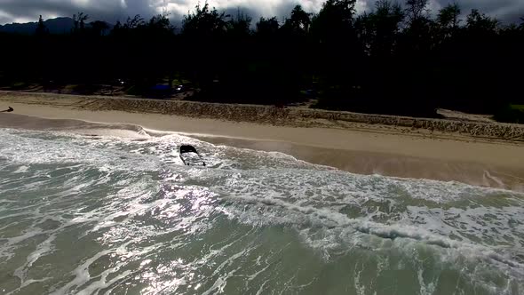 Aerial shot of partially sunken boat at Bellows Field Beach Park.