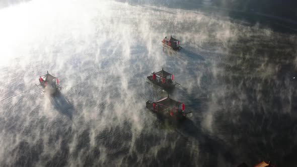 Aerial View of Sunrise with Fog Over Ban Rak Thai Chinese Village Near a Lake in Mae Hong Son