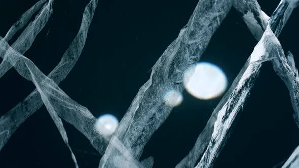 Cracks and Bubbles in Transparent Blue Ice of Baikal Lake Dolly Motion Close Up