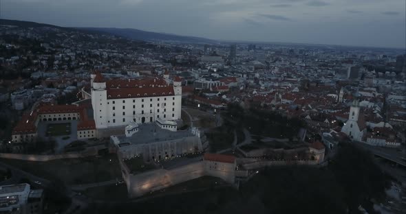 Wide Aerial shot of Bratislava castle and old town at twilight