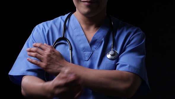 Close-up shot: Doctor wearing lab uniform of hospital.