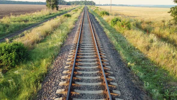 Straight Railway Tracks Train Road Through Fields and Forests