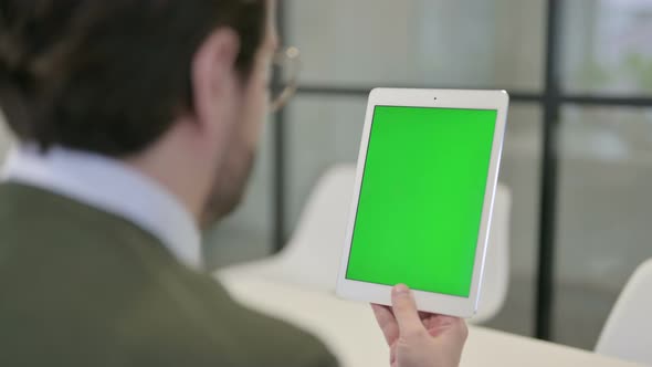 Businessman Using Tablet with Green Screen