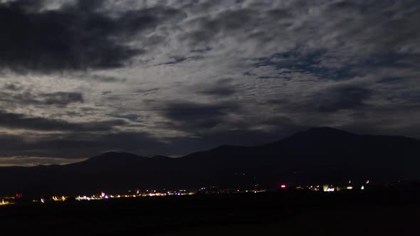 Night time lapse with Mountains and Clouds