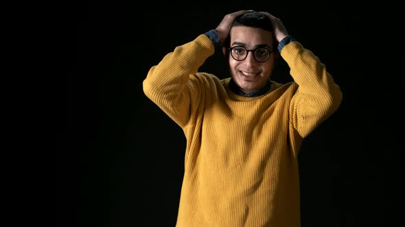 Annoyed Young Arab Man on Dark Background