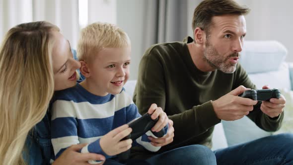 Family playing video game together