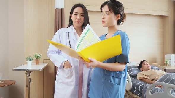 Portrait of smiling doctors standing together on the ward room Checking patient