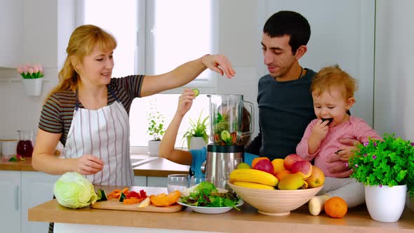 The Family Prepares Smoothies at Home