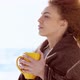 Beautiful Pensive Redhead Woman at the Beach Watching the Sea - VideoHive Item for Sale