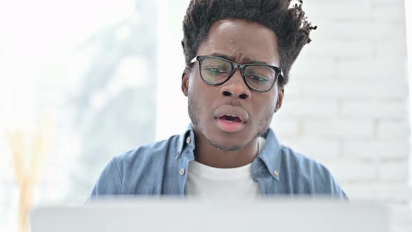 Portrait of Young African Man Get Shocked on Laptop