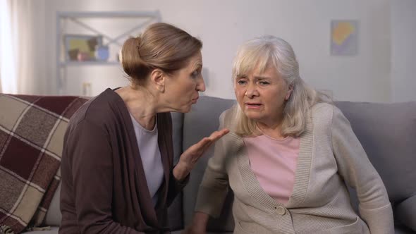 Old Woman Listening for Her Senior Friend, Problems With Hearing, Deafness