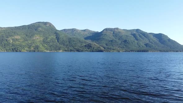 Flying Over Water on West Coast Lake Kennedy Lake, Laylee Island, Vancouver Island, Canada