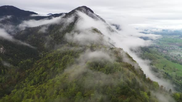 Flying over misty mountains and hills