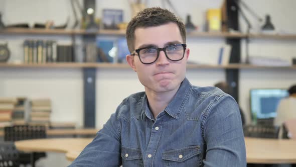 Creative Young Man in Glasses Denying By Shaking Head No