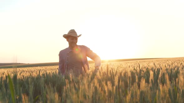 Young Farmer at Sunset in the Field
