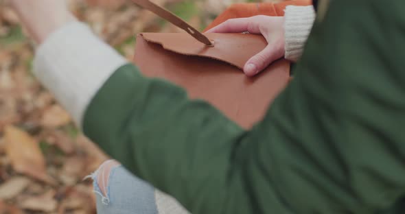 Young Woman Open Her Diary To Bring Her Memories Back. A Bit of Nostalgia During Autumn.slow Motion