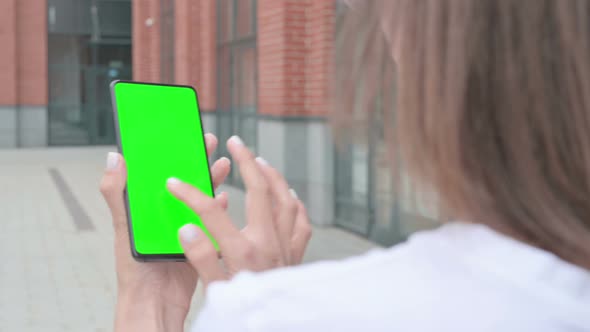 Walking Woman Using Smartphone with Green Screen