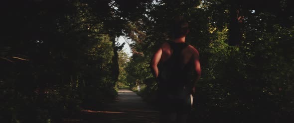 Man runs through forest