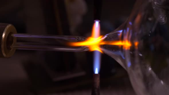 GlassBlower Separates Glass Pieces