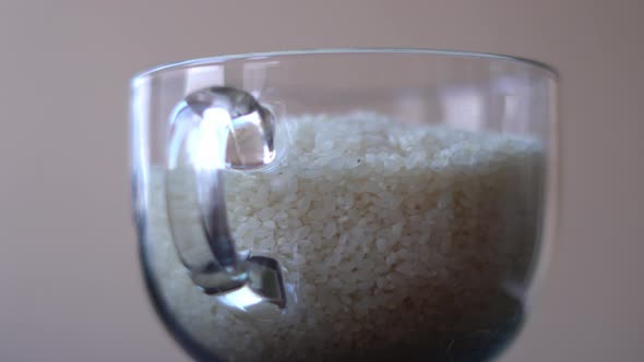 White Polished Rice Spinning in a Glass Bowl Closeup