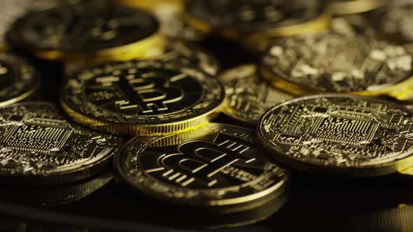Rotating shot of Bitcoins (digital cryptocurrency) - BITCOIN 0604