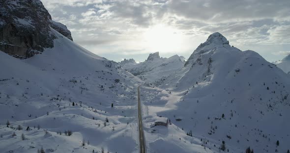 Forward Aerial Along Road in Snowy Valley at Valparola Pass