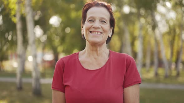 Happy Aged Woman at the Park