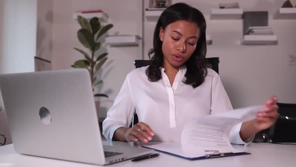 Resume is Checked By Woman on Staff in Office on Video Meeting on Computer Spbi