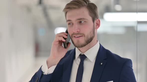 Young Businessman Talking on Phone