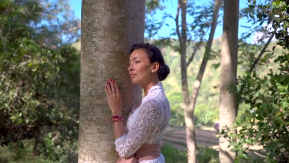 Portrait of Beautiful Woman Hugging the Tree Trunk in the Forest Love Nature Concept Connection with