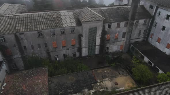 Spooky view of big Sanatorium old abandoned courtyard, Caramulo in Portugal. Aerial orbit