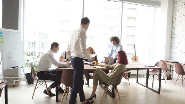 Modern Business Company Open Space Office with an Efficient Multiracial Team of Male and Female