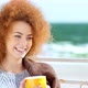 Beautiful Pensive Redhead Woman at the Beach Drinking Tea - VideoHive Item for Sale