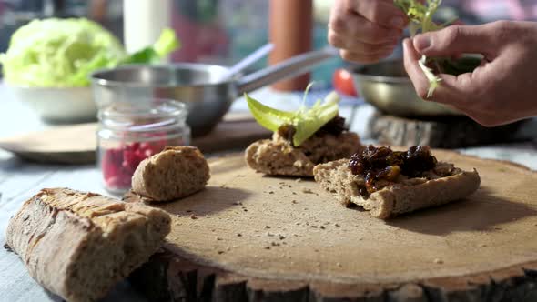 Hands Preparing Sandwiches.