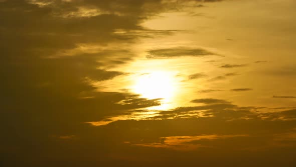 Time lapse sunset sunrise and beautiful twilight fluffy storm cloudy blue and yellow sky