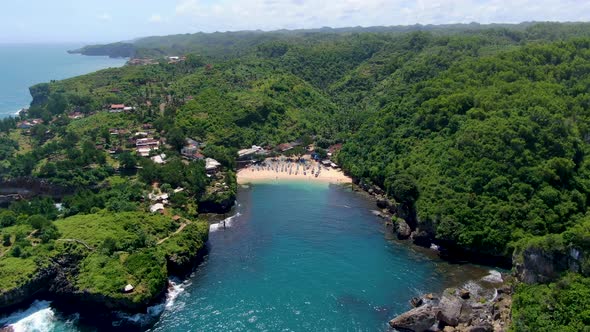 Tranquil hidden tropical cove, Gesing Beach Indonesia, aerial panorama