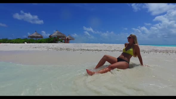 Ladies together tanning on beautiful seashore beach trip by transparent sea with white sandy backgro