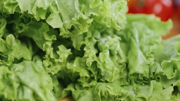 Chef Cuts the Salad Leaves with a Knife in Slow Motion Making a Salad Fresh Vegetables on a Cutting