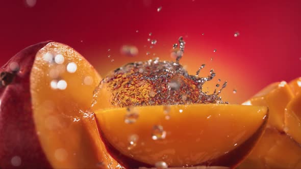 Slow Motion Shot of Mango Juice Splashing Through Mango Slices