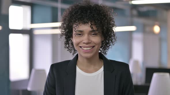 Portrait of Happy African Businesswoman Looking at the Camera and Smiling