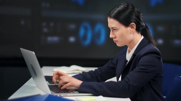 Focused Woman Financial Broker Working Laptop at Global Digital Stock Exchange