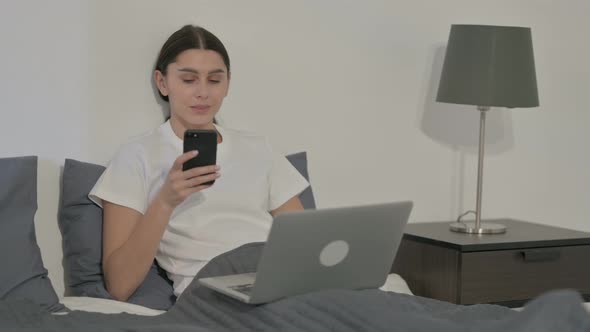 Indian Woman making Video Call on Tablet in Office