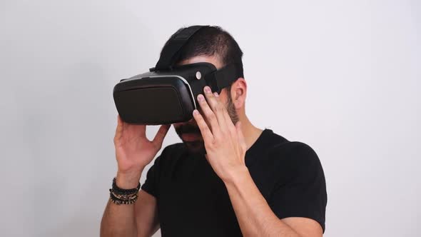 Young Man Taking Off VR Glasses Headset Gesturing