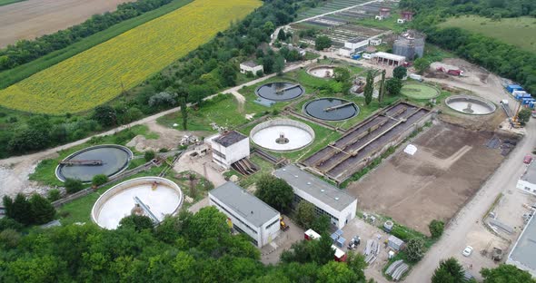 Aerial footage of wastewater treatment plant.  Cleaning construction for a sewage treatment